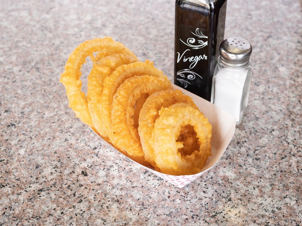 Crispy seafood served with chips and dipping sauce.