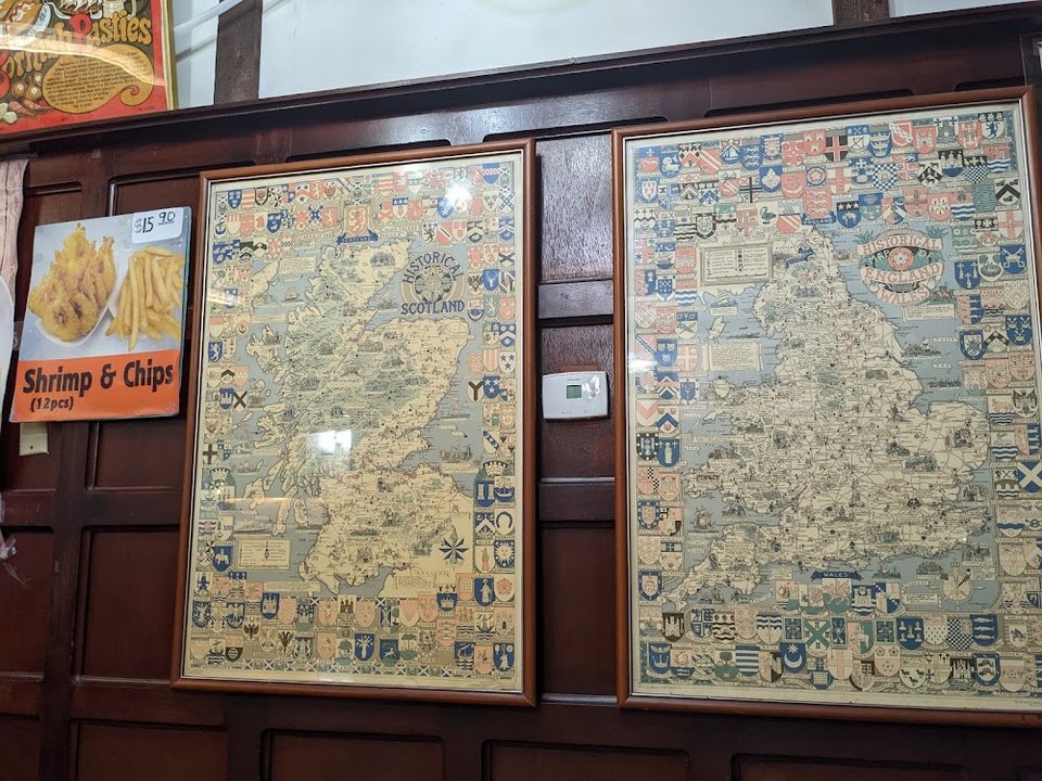 Restaurant menu listing fish, shrimp, and scallops.