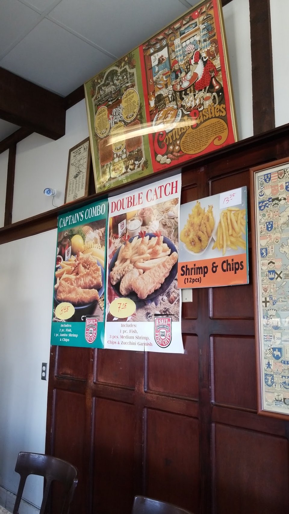 Counter menu with fried seafood and tartar sauce.